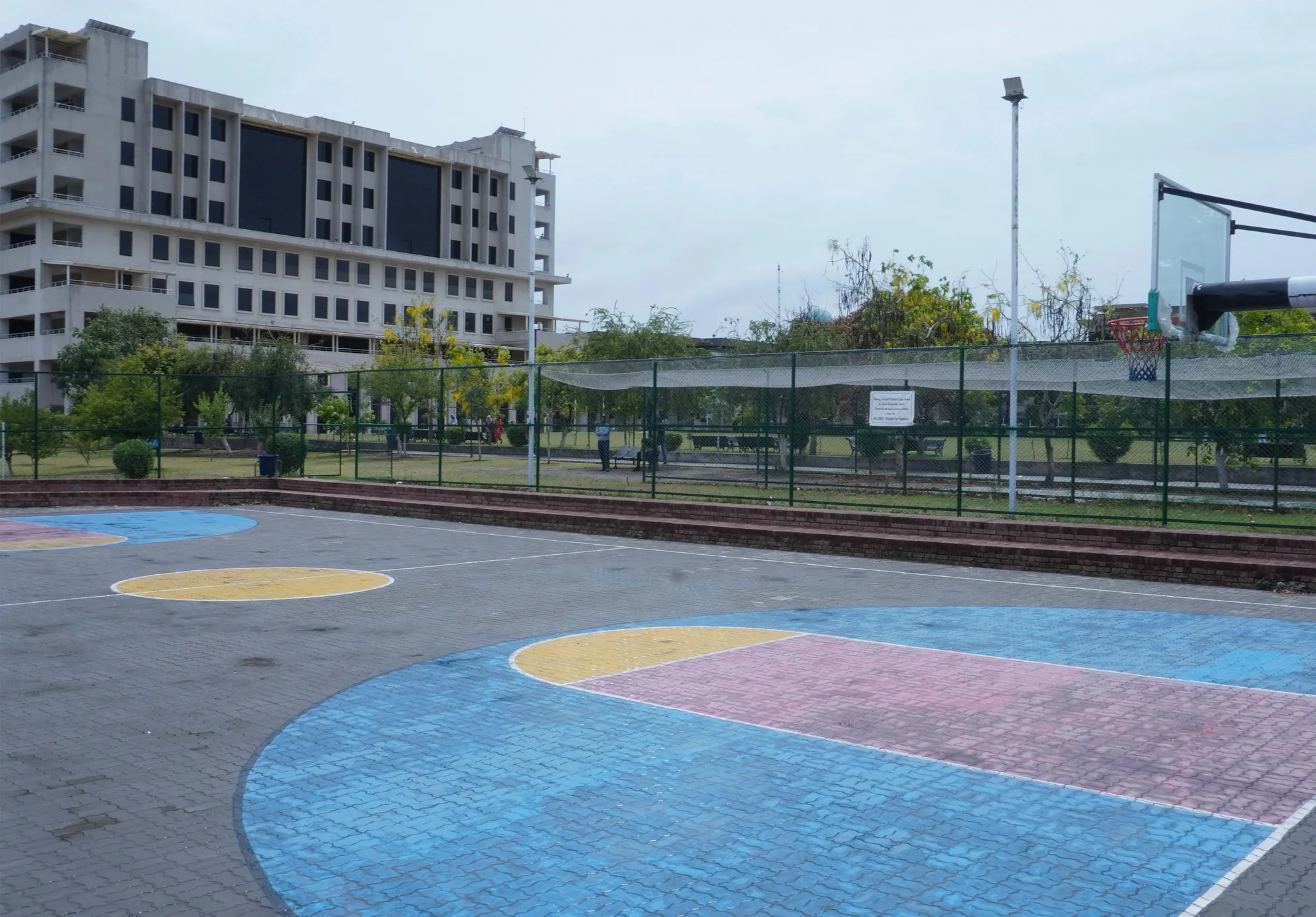 FAST NUCES academic building and outdoor court