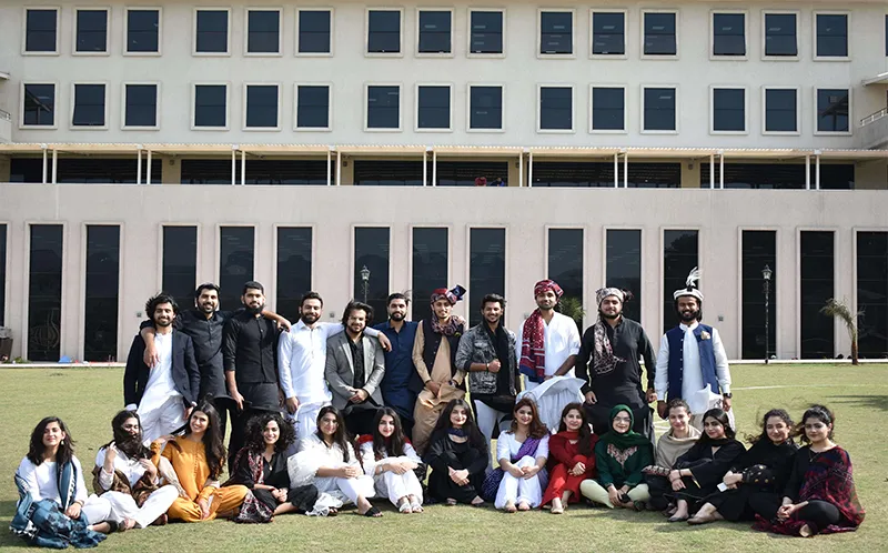 Students in front of a FAST NUCES building facade